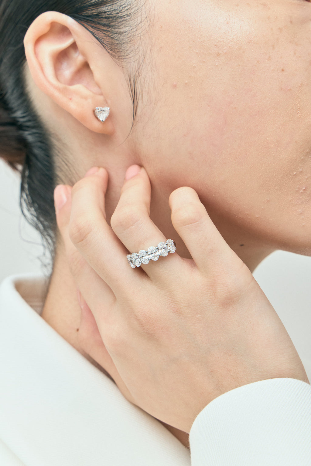 Model wears Kensington 1ct heart shape diamond studs in 18ct white gold
