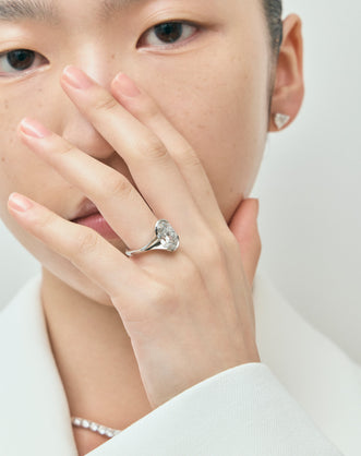 Model wears Bond 4ct oval solitaire semi-bezel engagement ring in 18ct white gold