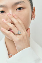 Model wears Bond 4ct oval solitaire semi-bezel engagement ring in 18ct white gold