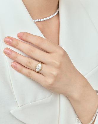 Close-up Mercer East-West 3ct marquise solitaire engagement ring in 18ct yellow gold