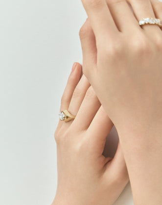 Model wears Mercer East-West 3ct marquise solitaire engagement ring in 18ct yellow gold