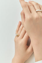 Model wears Mercer East-West 3ct marquise solitaire engagement ring in 18ct yellow gold