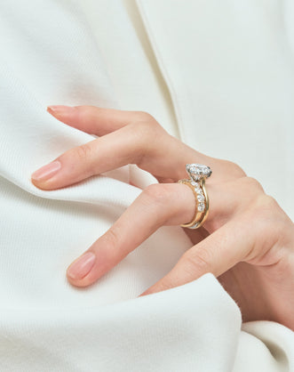 Model wears Model wears Oxford round brilliant six claw solitaire classic engagement ring in 18ct yellow gold