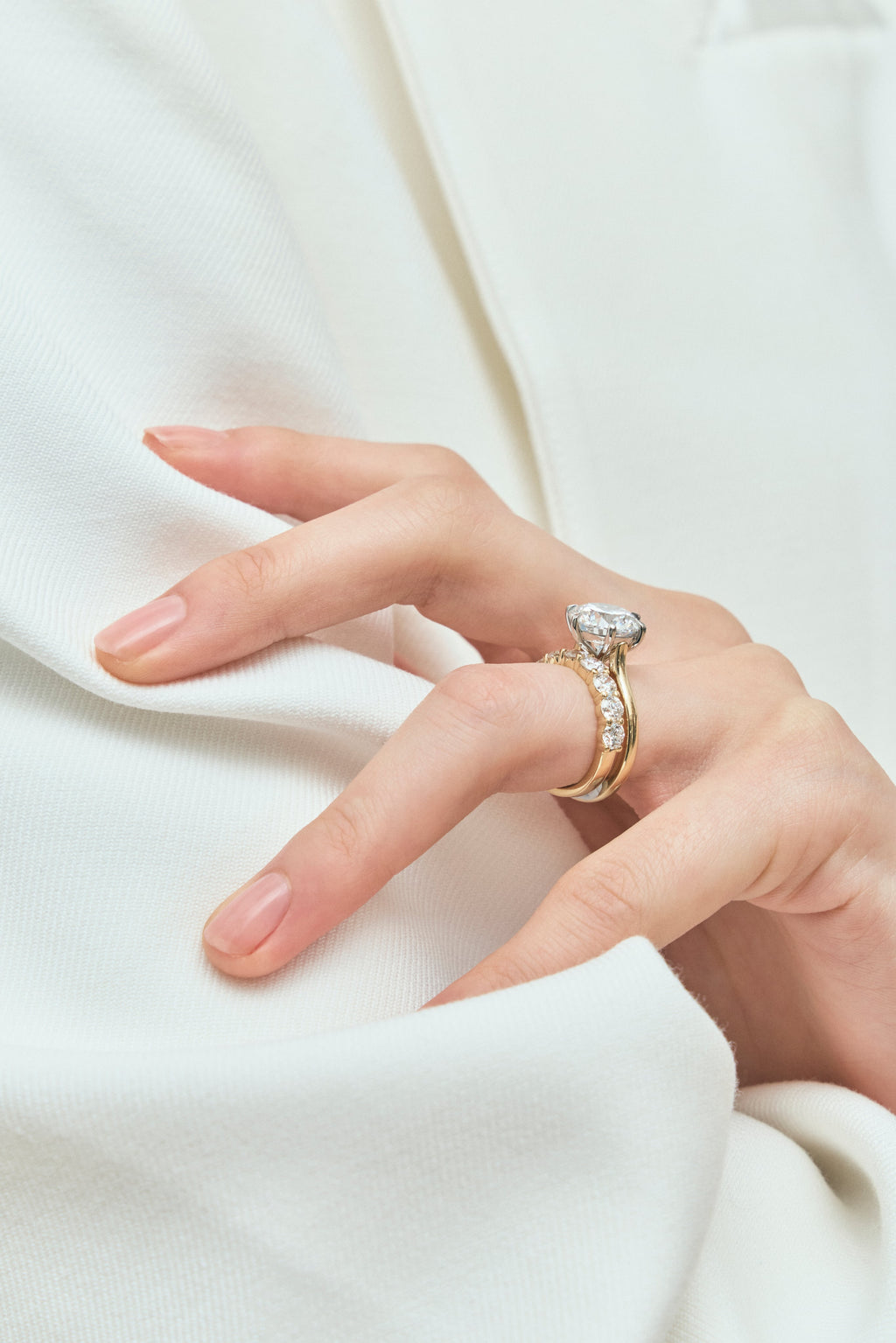 Model wears Model wears Oxford round brilliant six claw solitaire classic engagement ring in 18ct yellow gold