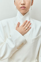 Model wears Soho 0.50ct emerald cut half eternity band in 18ct yellow gold