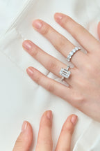 Close-up model wears Cheyne 0.20ct round brilliant half eternity band in 18ct white gold