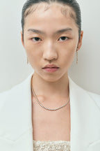 Model wearing York bezel set tennis necklace in 18ct yellow gold