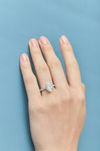 Close-up Nassau oval cut diamond band engagement ring in 18ct white gold