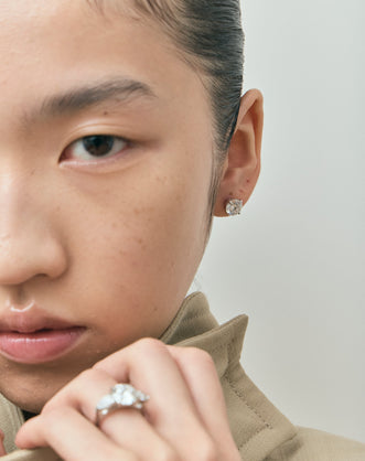 Model wears Rowan 2ct round brilliant cut diamond studs in 18ct white gold