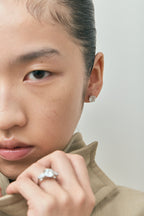 Model wears Rowan 2ct round brilliant cut diamond studs in 18ct white gold