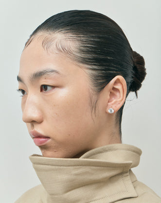 Model wears Rowan 2ct round brilliant cut diamond studs in 18ct white gold