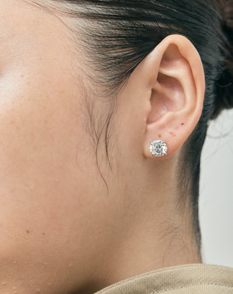Model wears Rowan 2ct round brilliant cut diamond studs in 18ct white gold