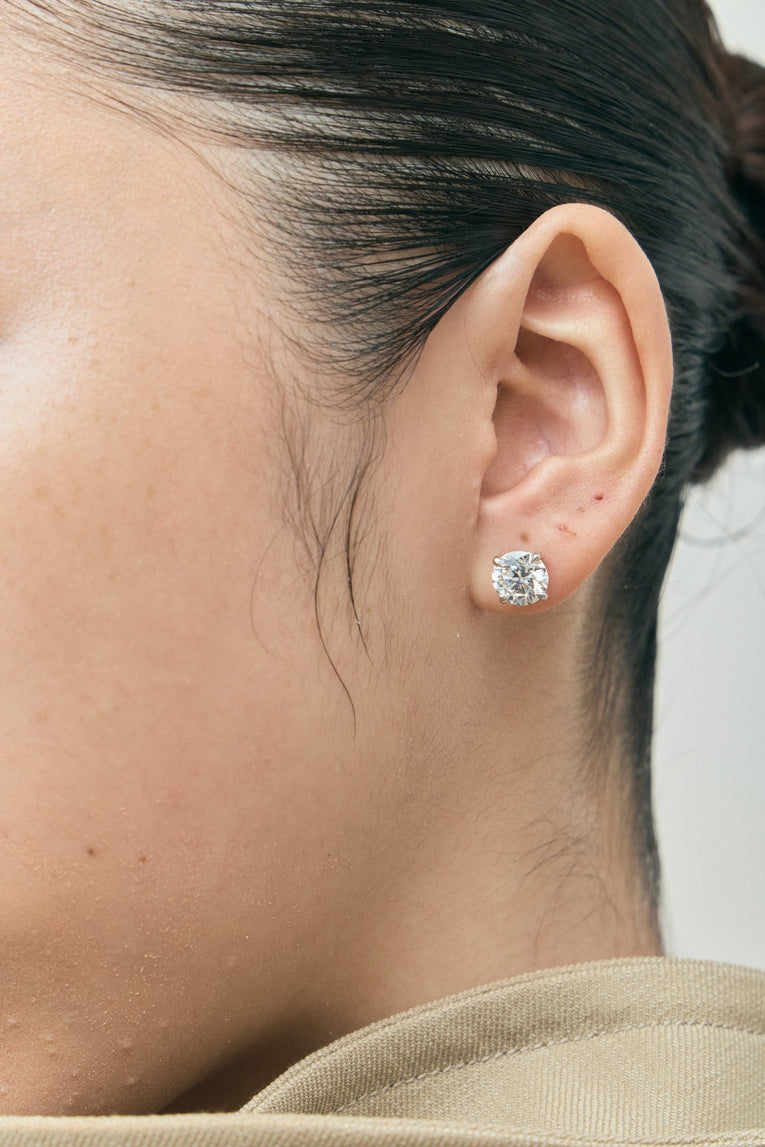 Model wears Rowan 2ct round brilliant cut diamond studs in 18ct white gold