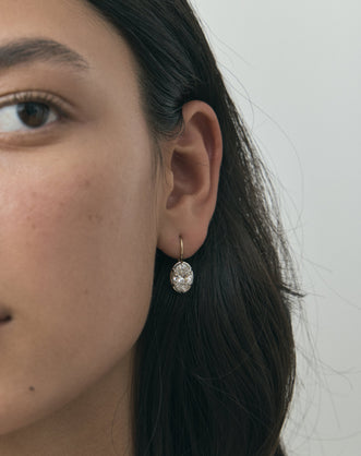 Model wears Vendôme 2ct oval button style drop earrings in 18ct yellow gold
