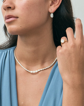 Model wears Mateo Semi bezel graduated necklace in 18ct yellow gold