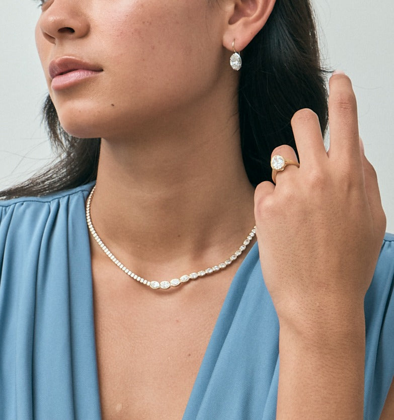 Model wears Mateo Semi bezel graduated necklace in 18ct yellow gold