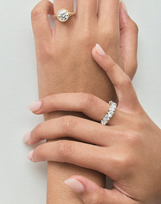 Model wears Melrose 0.30ct heart shape half eternity band in 18ct white gold