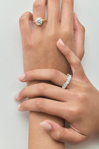 Model wears Melrose 0.30ct heart shape half eternity band in 18ct white gold