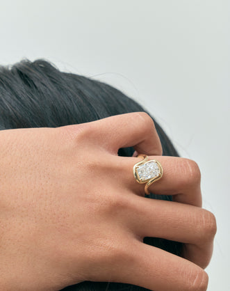 Model wears Prince 3ct radiant cut curved band engagement ring in 18ct yellow gold