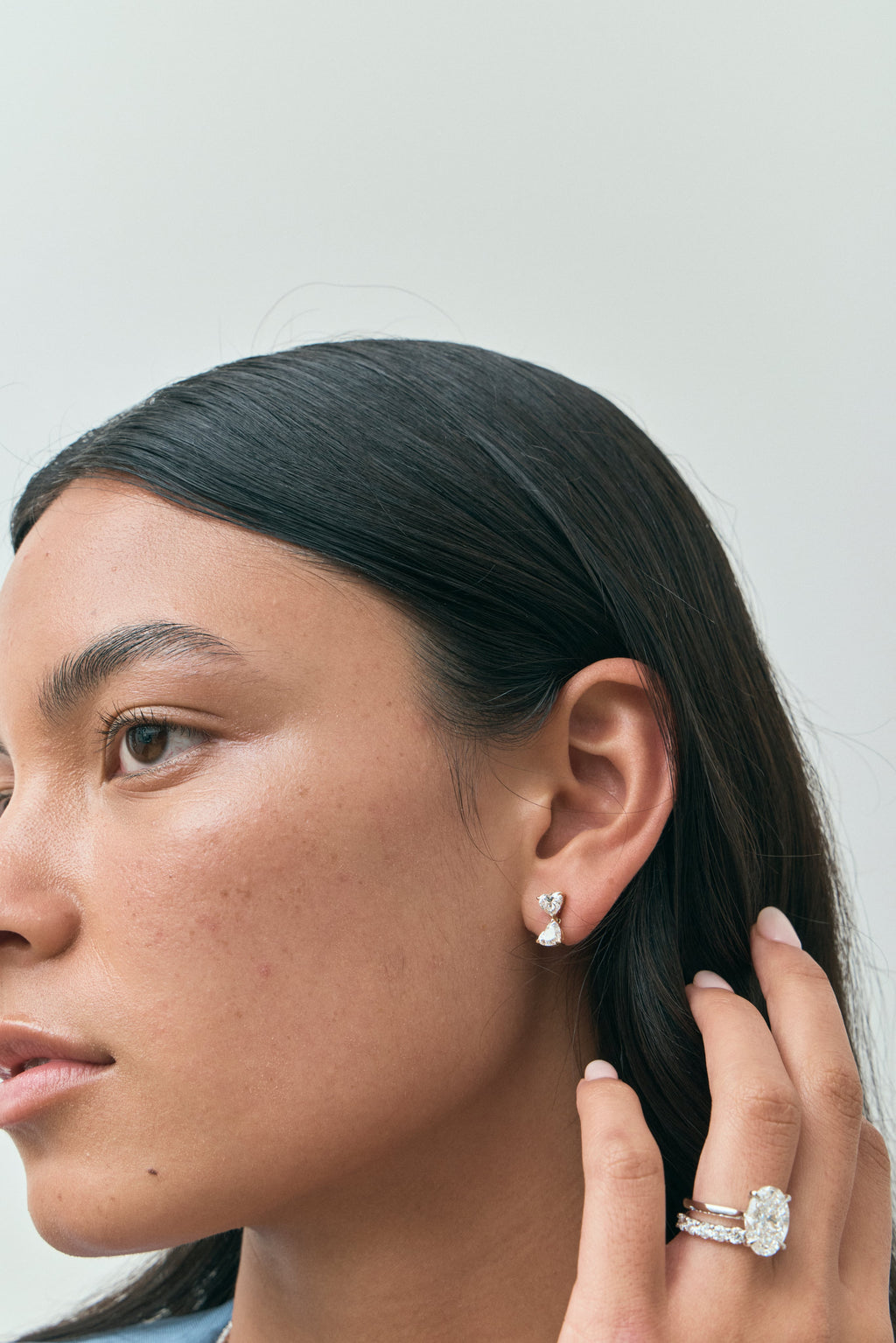 Model wears Notting romantic pair double 0.50ct heart shape drop earrings in 18ct yellow gold