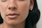 Model wears Notting romantic pair double 0.50ct heart shape drop earrings in 18ct yellow gold