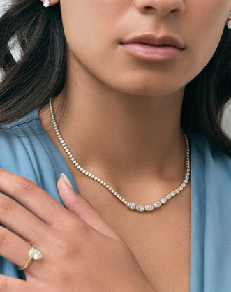 Model wears Mateo Semi bezel graduated necklace in 18ct yellow gold