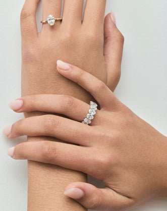 Model wears Model wears Florence oval solitaire classic engagement ring in 18ct yellow gold