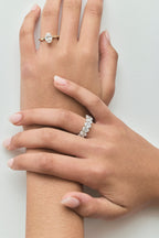 Model wears Model wears Florence oval solitaire classic engagement ring in 18ct yellow gold