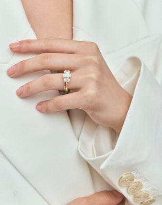 Model wears Cambon 1.8mm fine plain wedding band in 18ct yellow gold