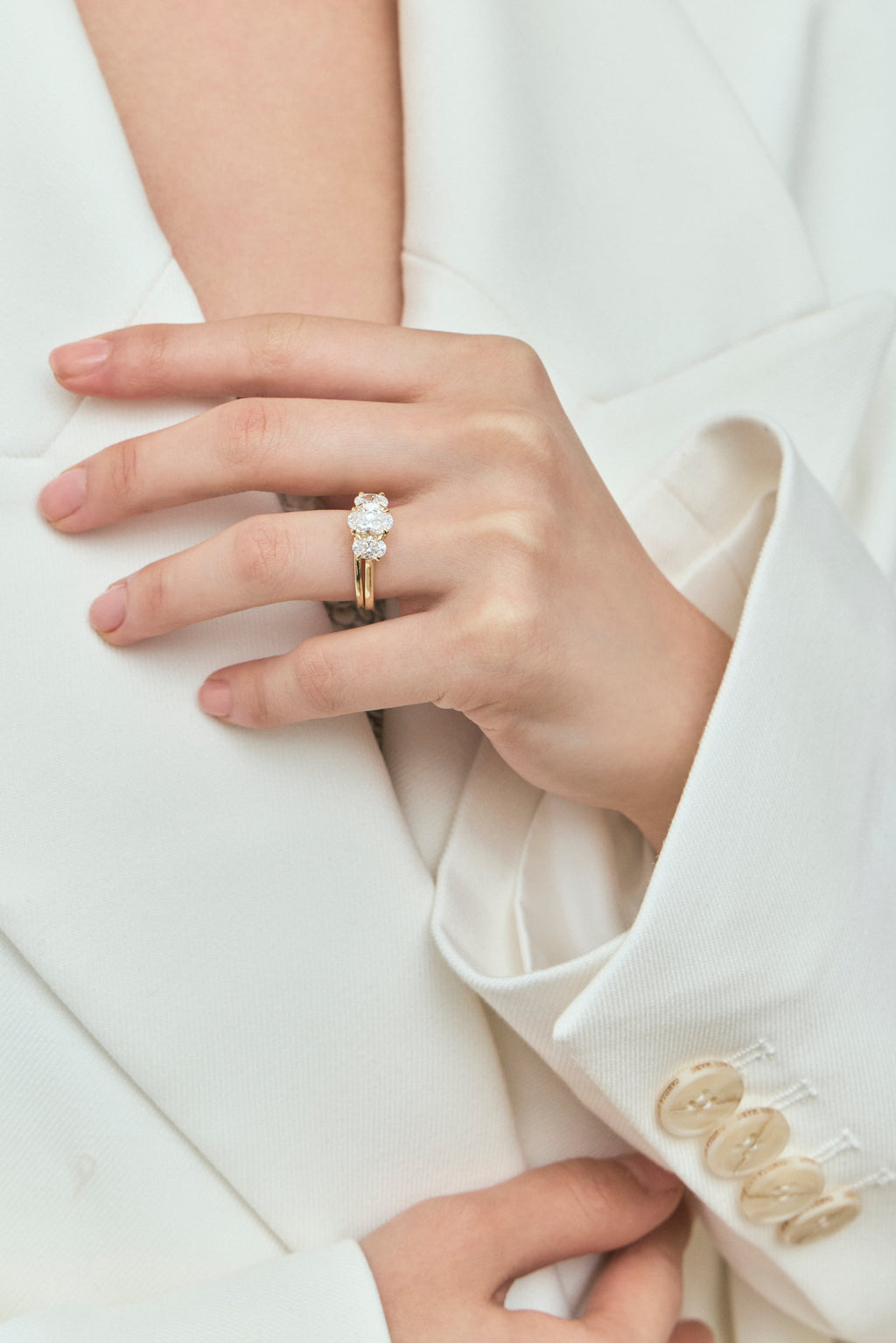 Model wears Cambon 1.8mm fine plain wedding band in 18ct yellow gold
