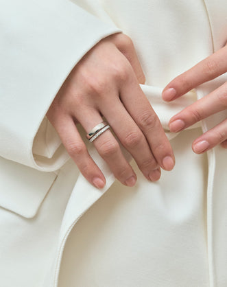 Model wears Carson 1.8mm round brilliant half set wedding band in 18ct yellow gold 