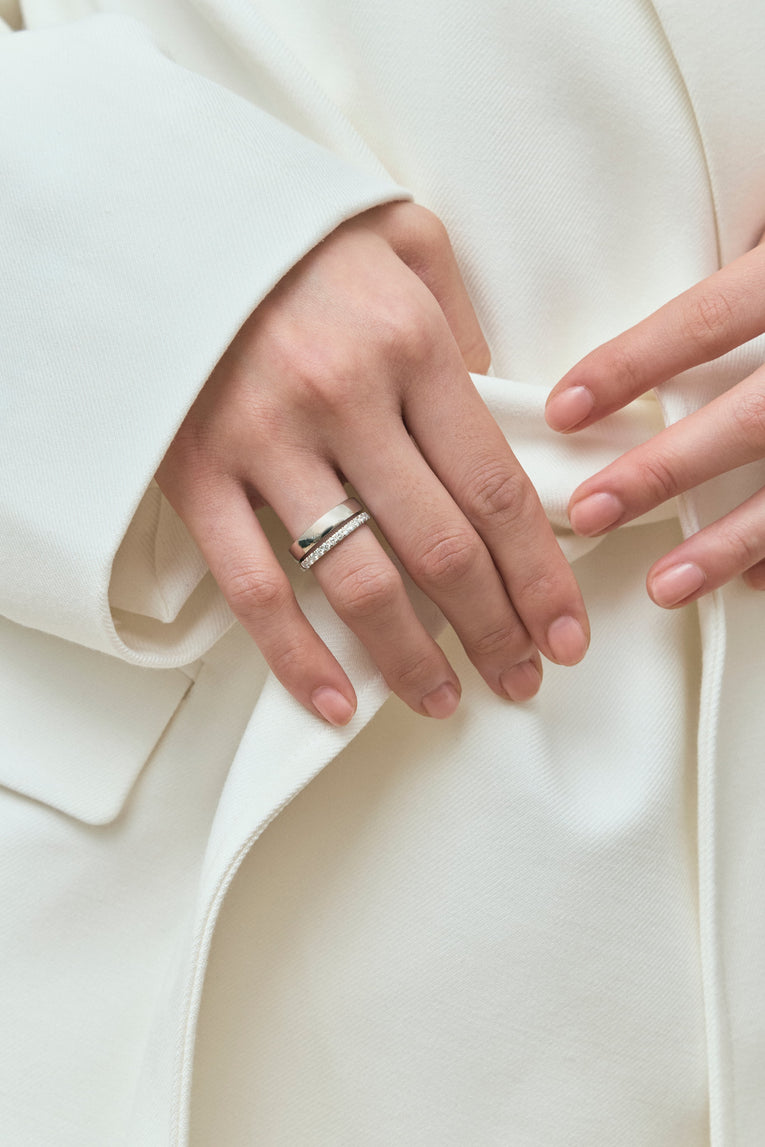 Model wears Carson 1.8mm round brilliant half set wedding band in 18ct yellow gold 
