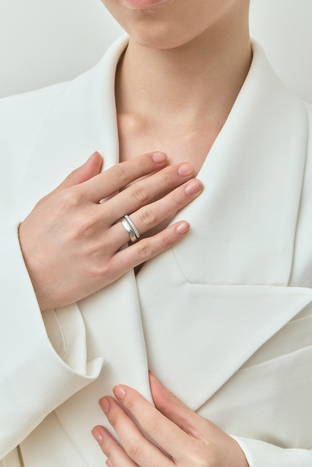 Model wears Rivoli 4mm classic plain wedding band in 18ct white gold