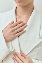 Model wears Rivoli 4mm classic plain wedding band in 18ct white gold