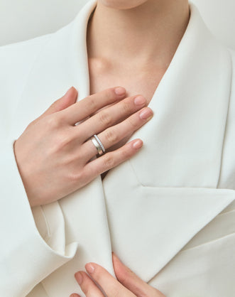 Model wears Carson 1.8mm round brilliant half set wedding band in 18ct white gold