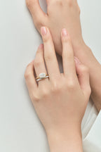 Close-up Maddox oval solitaire bezel east-west engagement ring in 18ct yellow gold