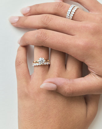 Model wears Model wears Oxford round brilliant six claw solitaire classic engagement ring in 18ct yellow gold