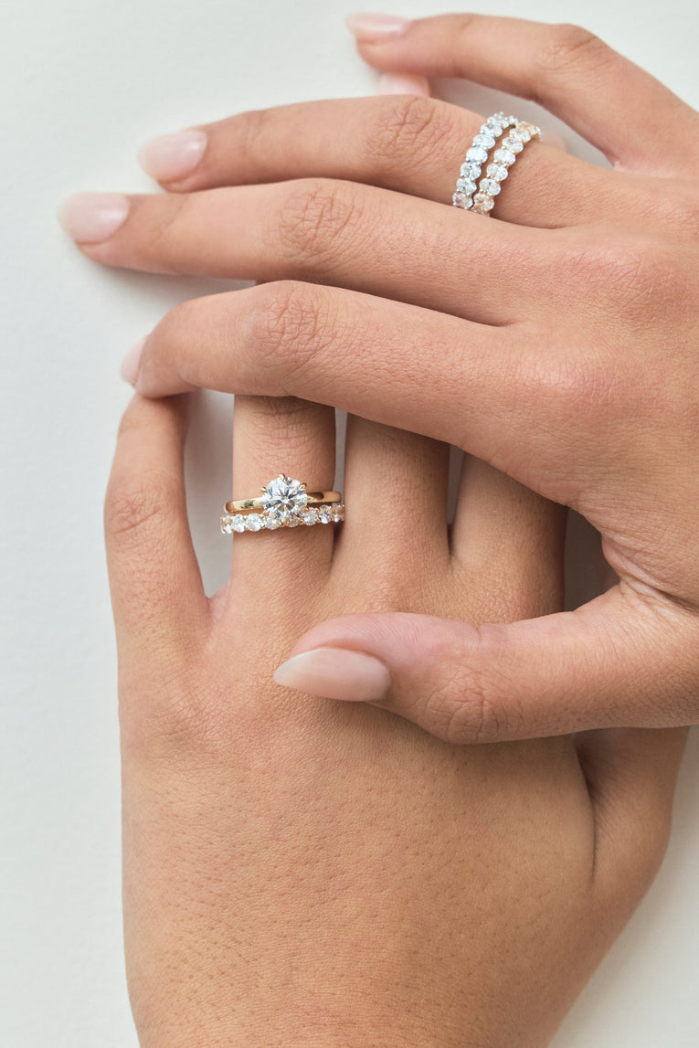 Model wears Model wears Oxford round brilliant six claw solitaire classic engagement ring in 18ct yellow gold