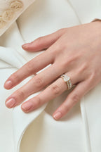 Model wears Beverly emerald cut diamond band engagement ring in 18ct yellow gold 