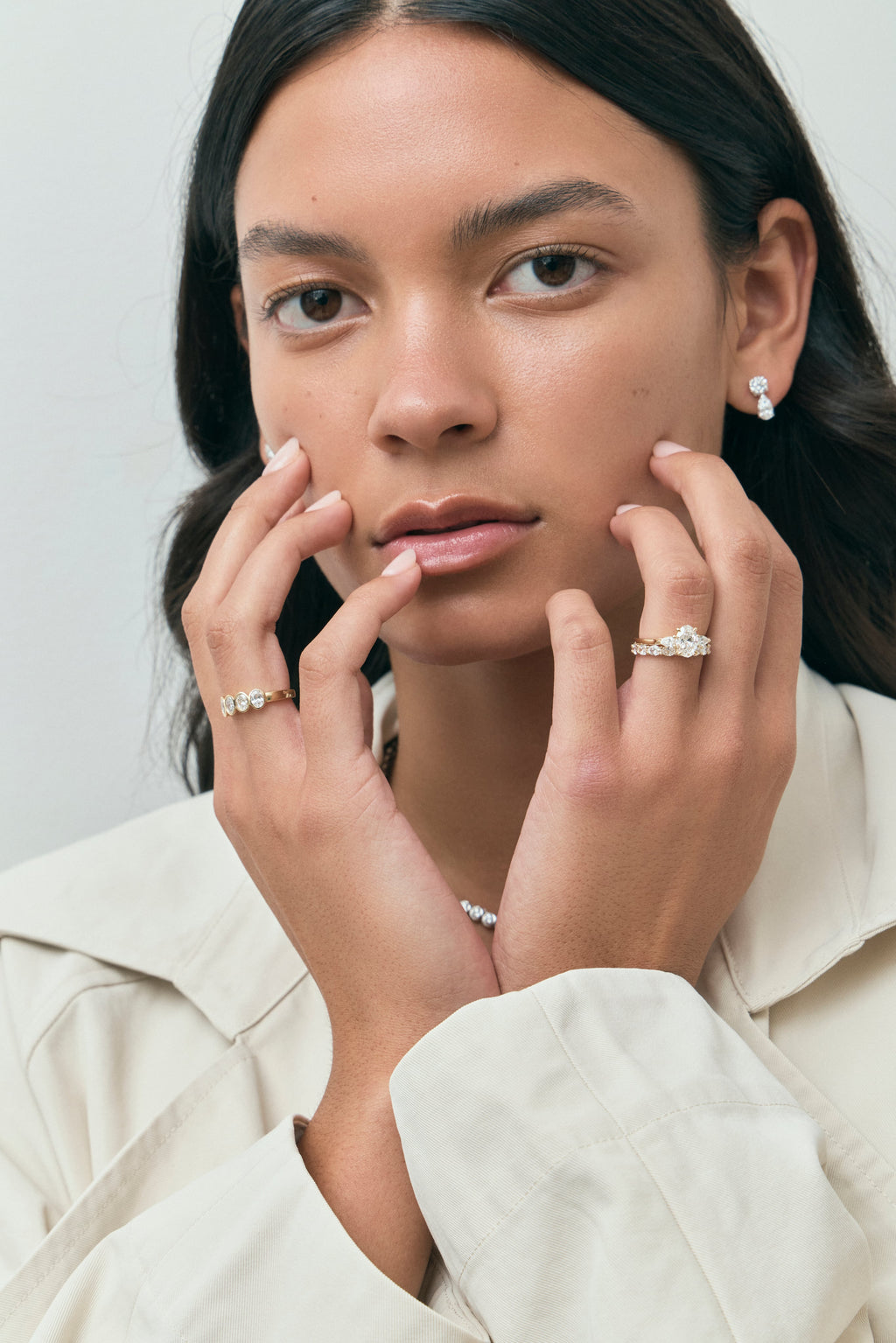 Model wears Bonaparte oval pear side stone engagement ring in 18ct yellow gold