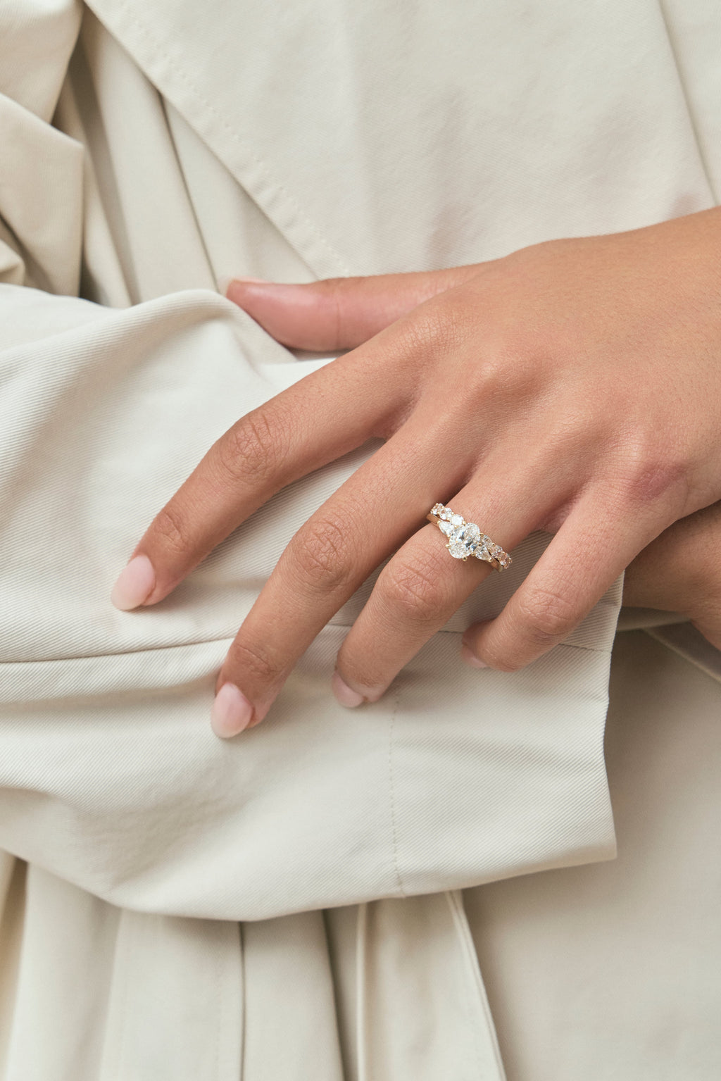Close-up Bonaparte oval pear side stone engagement ring in 18ct yellow gold