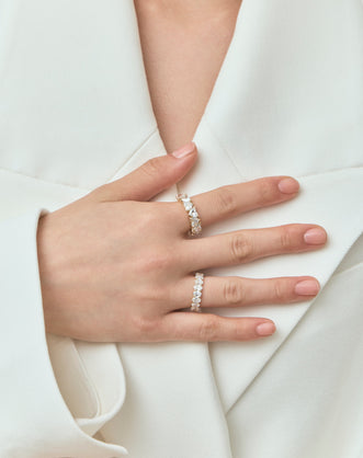 Model wears Melrose 0.50ct heart shape half eternity band in 18ct yellow gold