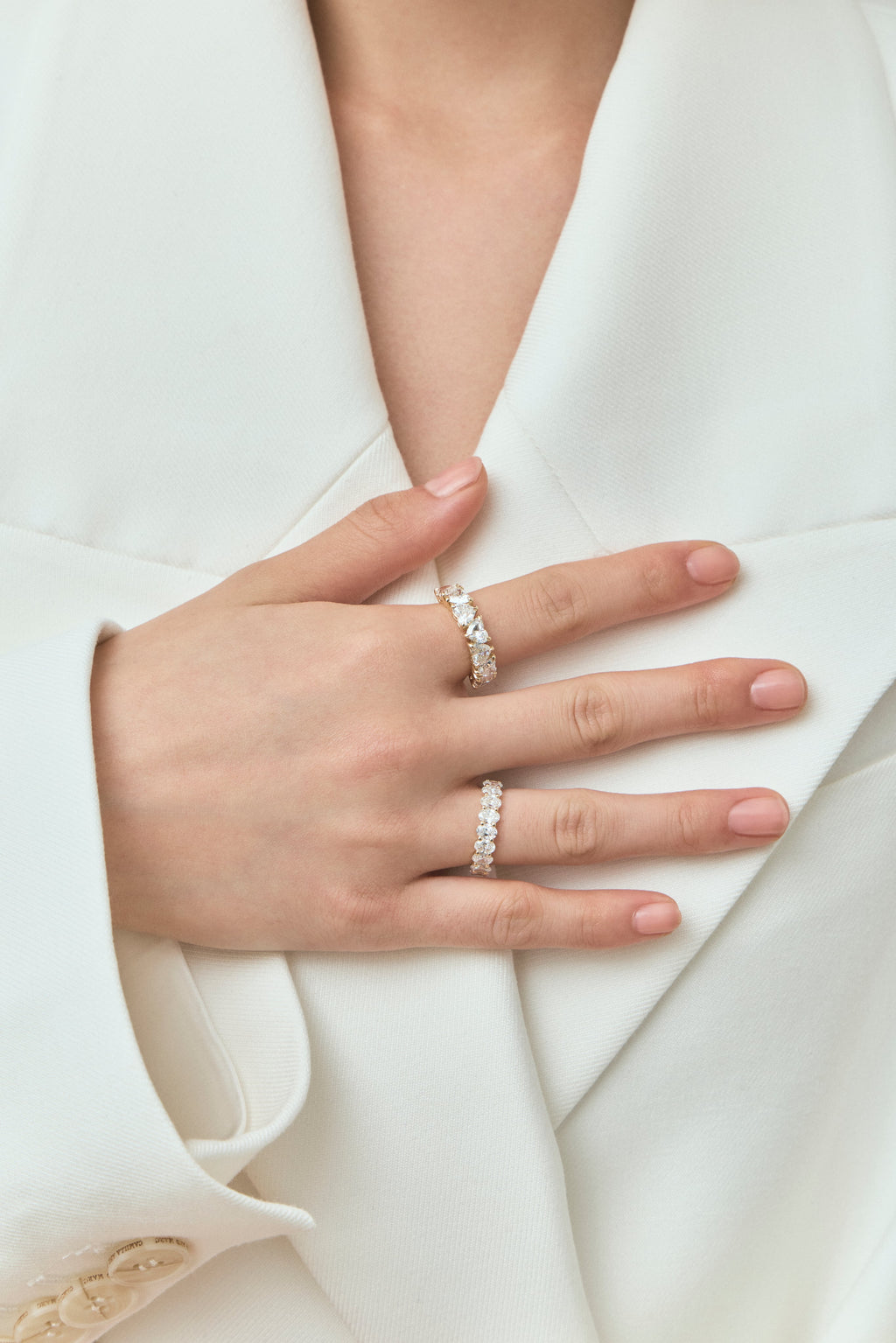 Model wears Melrose 0.50ct heart shape half eternity band in 18ct yellow gold