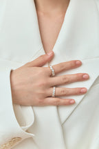 Model wears Melrose 0.50ct heart shape half eternity band in 18ct yellow gold