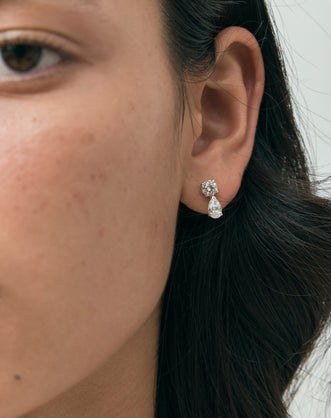 Model wears Saville 0.50ct round brilliant pear cut drop earrings in 18ct white gold