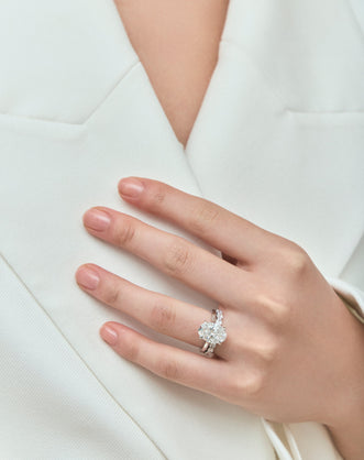 Model wears Hastings 0.10ct oval East-West half set wedding band in 18ct white gold
