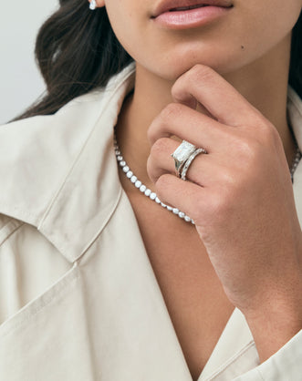 Model wears James 0.10ct Emerald Cut East-West Half Set Wedding Band 18ct white gold