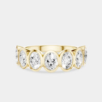Tournon 0.20ct oval bezel set half eternity band in 18ct yellow gold