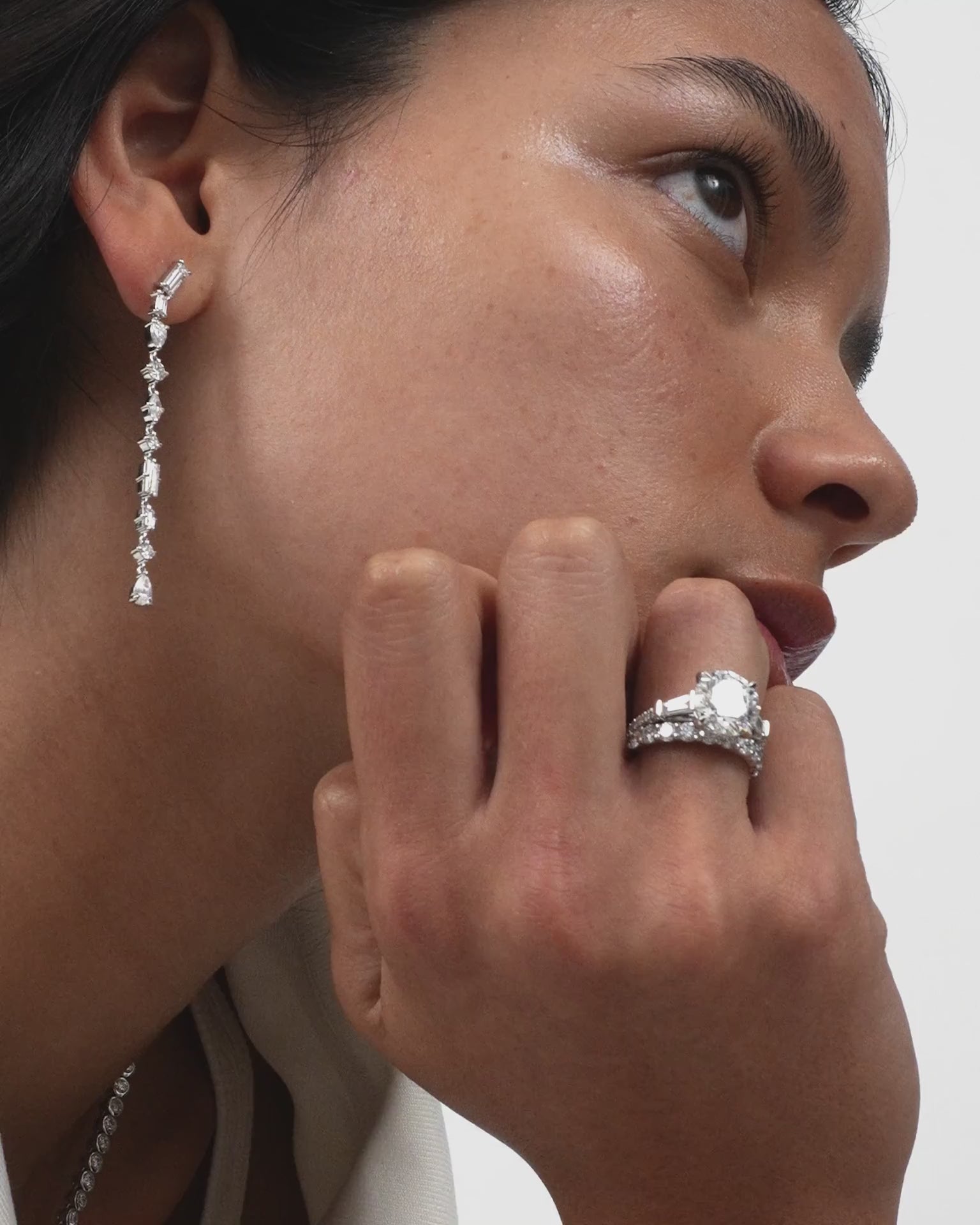 Model wears Paddington 3mm round brilliant half set wedding band in platinum