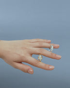 Model wears Mercer East-West 3ct marquise solitaire engagement ring in 18ct yellow gold
